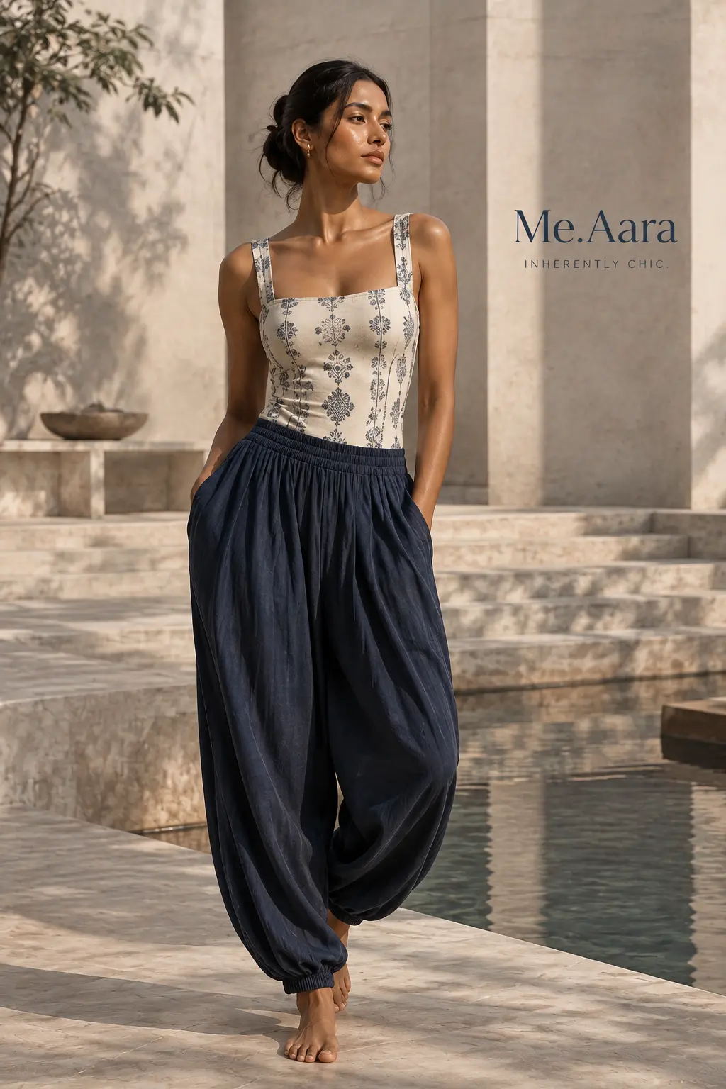 Model wearing the Neelambari indigo bodysuit with navy draped trousers